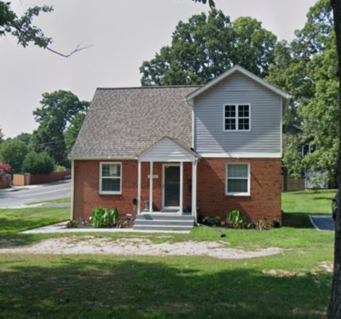 Completed second-floor addition — full second floor added to brick ranch home