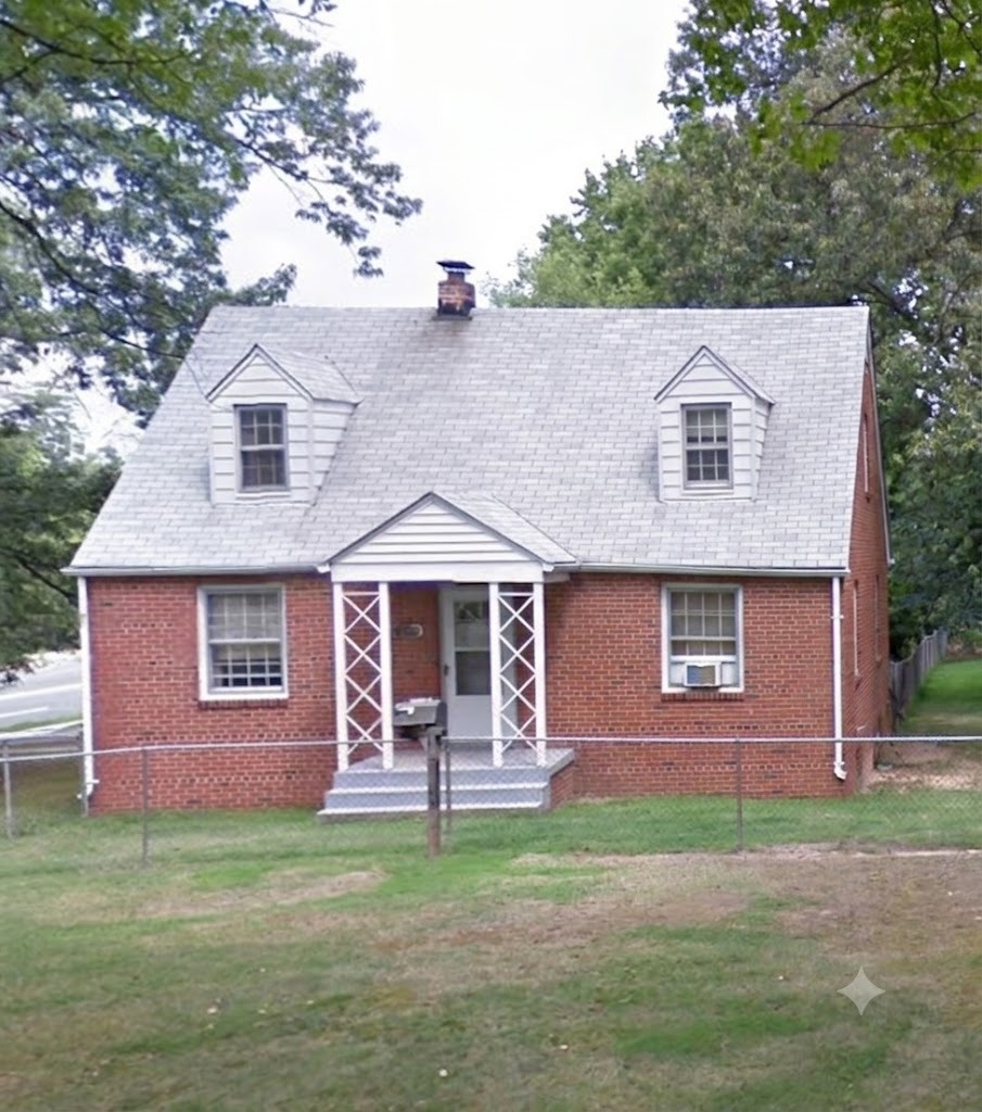 Before — brick Cape Cod home with dormered attic prior to second-floor addition