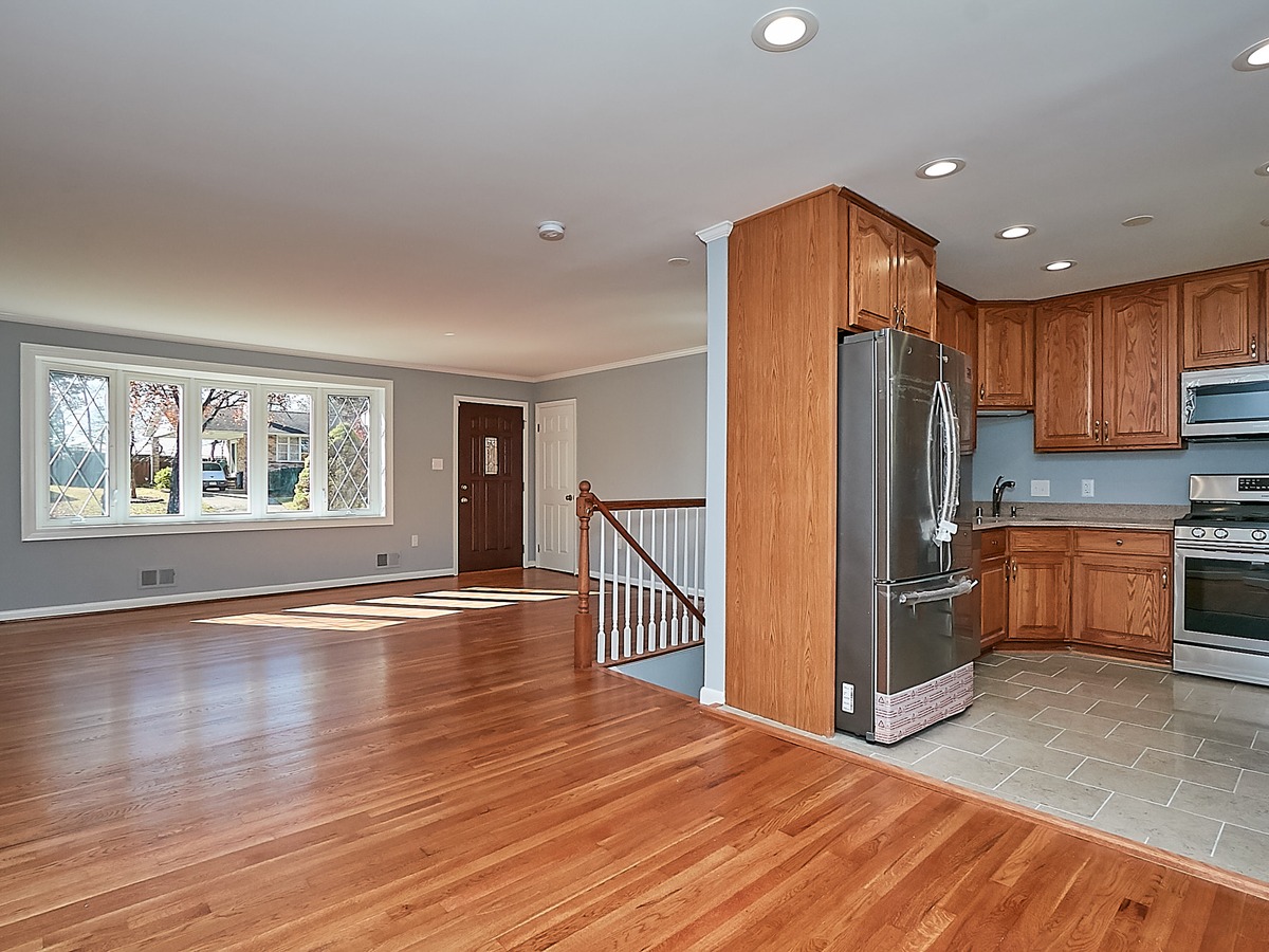 Full interior renovation — new windows, flooring, kitchen, paint, and ceilings